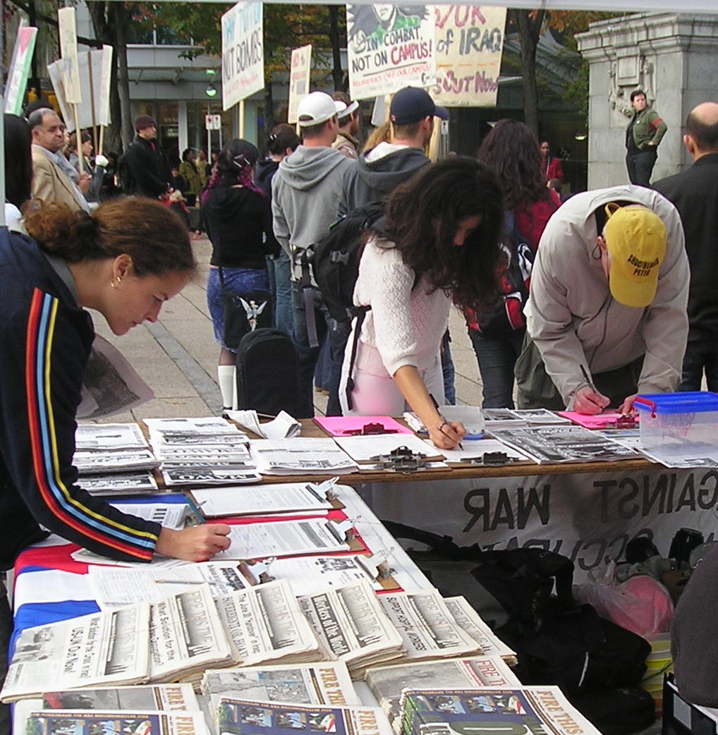 Petition being signed at the MAWO table on October 22nd